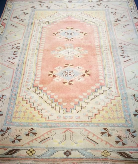 A Turkish carpet 230 x 198cm